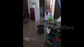 Indonesia Resident shows flooding damage at her house in Denpasar Bali