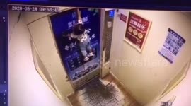 Chinese toddler dragged up after leash attached to her hand gets stuck in doors