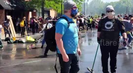 Community clean damage at Native American youth centre that burned down during George Floyd riots