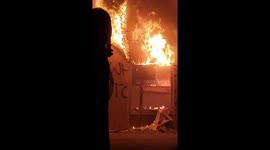 Cheers ring out as Minneapolis branch of Wells Fargo goes up in flames