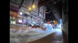 Protesters throw back tear gas in Mongkok on 12 November 2019
