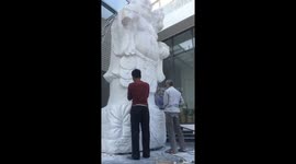 Vietnamese artist sculpts giant stone statue of Buddha for restaurant