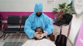 Beauticians use PPE as salons reopen in designated green and orange zones in India