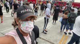 Me the Photojournalist filming a selfie at the George Floyd Protests near CBS studios Los Angeles just after police car explodes with Los Angeles Firefighters and LAPD in surrounded by peaceful protestors