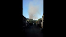 Helicopter drops water on wildfires raging in Rhondda Valley, South Wales