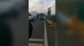 Chinese children move safety cones on highway to block road causing traffic jam