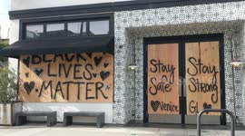 Abbot Kinney Blvd in Venice Beach board up their businesses.
