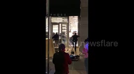 Widespread looting hits Manhattan as curfew sets in