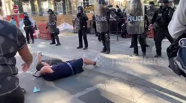 Police charge towards protesters discharging pepper spray close to the White House