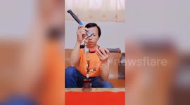 Talented Chinese man shows off incredible balancing skills using hammers and walnuts