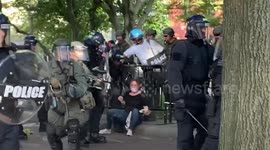Young woman manhandled by police officers during protest outside White House