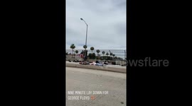 LA protesters lay down on road for 9 minutes to match length officer knelt on George Floyd's neck