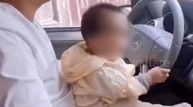 Father fined after allowing toddler driving SUV on Chinese road