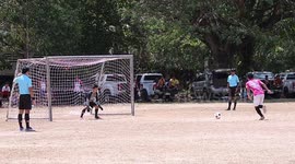 Penalty kick fail sees football crash back off post and knock over Thai player
