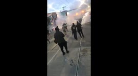 Dramatic footage shows tear gas fill the air as police clash with protesters in Seattle