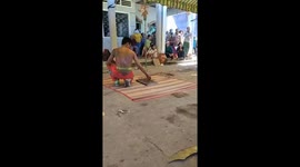 Man lying on bed of nails has bricks broken on him in bizarre martial arts display