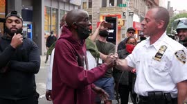 Amid week of clashes, NYC cops and protesters share a friendly moment