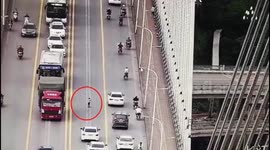 Five-year-old rides scooter on busy road in China