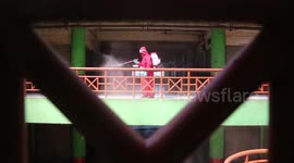 Fire and Rescue Service in Indonesia routinely spray disinfectant in public space to prevent spread of COVID-19
