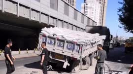Sinkhole opens up on Chinese road after transport truck drives over it seeing tyre explosion