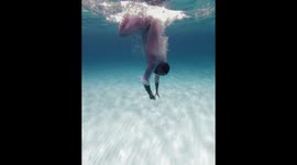 A boy swimming in blue waters