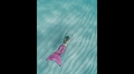 Mermaid haa fun underwater in Menorca