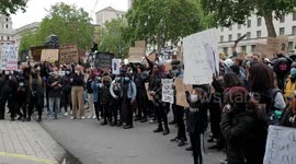Protesters chant 'Black Lives Matter' outside the gates of Downing Street in London