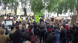 Black Lives Matter protesters clap in unison at Parliament Square