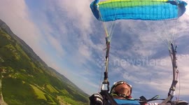 French paraglider undergoes intense 'simulated flight incident' course above lake