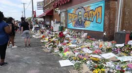 George Floyd anniversary: Hundreds of flowers laid by mural in Minneapolis