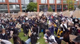 Black Lives Matter protesters hold a minutes silence