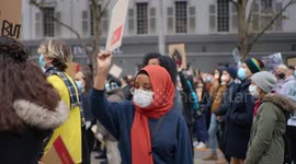 Young black girl wearing aboriginal flag at Black Lives Matter protest, Melbourne