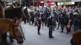 BLM protestors hold hands up to police, Melbourne