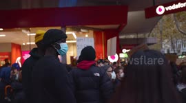 Young black BLM protestors watch chant, Melbourne