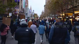 Two black men walk down Swanston Street during BLM protest, Melbourne