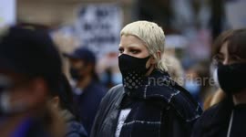 Young woman nods during BLM protest, Melbourne
