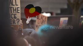 Aboriginal flag love heart at BLM protest, Melbourne
