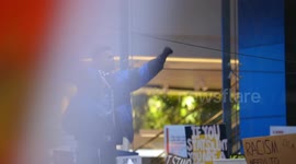 BLM protestor raises his fists, chants, Melbourne