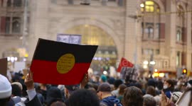 Aboriginal flag outside Flinders St Station during BLM protest, Melbourne