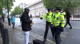 Touching moment police greet sax player during London BLM protest