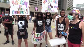 At Nathan Phillips Square, demonstrators chanted, held placards and posters, and listened to speakers.