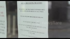 COVID-19 letter on window of restaurant with social distancing guidelines during Corona pandemic, during lockdown new normal