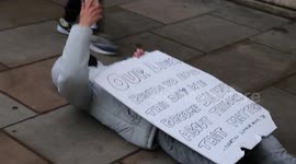 Black Lives Matter protester lays down to block riot police and takes a selfie