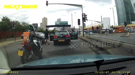 UK driver pursues motorbike and nearly knocks biker off