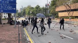 Protestors setting up a roadblock at the Hong Kong Polytechnic University during the university siege on 14 November 2019