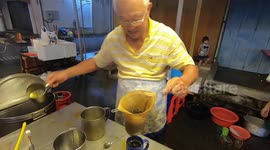 Watch this market stall make traditional Malaysian style coffee