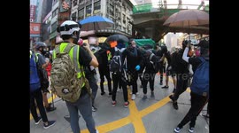 Protesters set fire to a barricade by throwing molotovs in October 2019