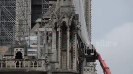 Workers begin risky operation to remove melted scaffolding on Notre-Dame
