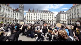 Thousands kneel and raise their fists as they pay an hommage to victims of police violence in France