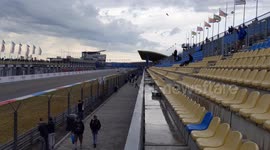 DTM racecars following the safety car during the warmup lap